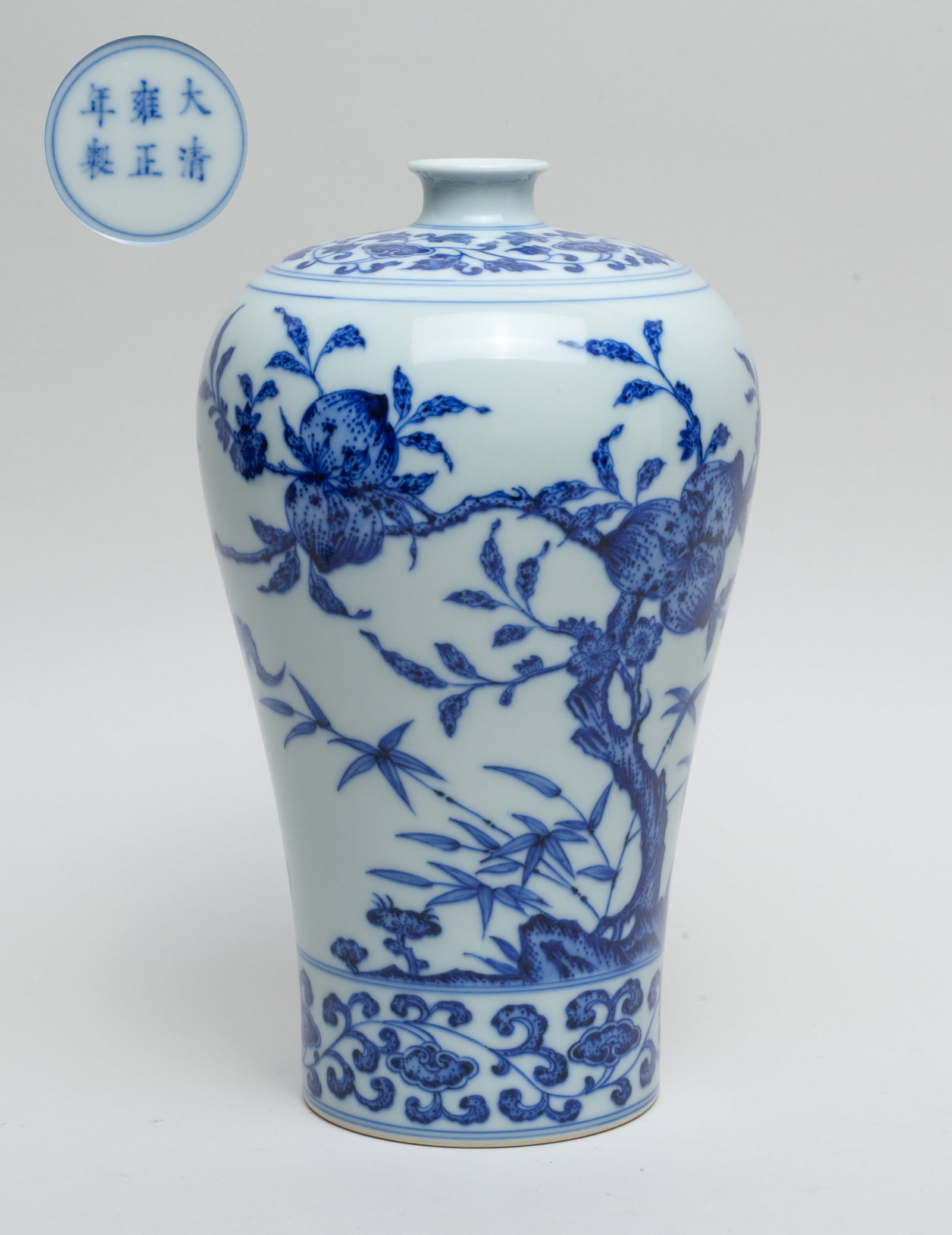 Chinese Blue & White Porcelain Vase: Of baluster form, the exterior painted with blossoming and fruiting peach tree, bats and lingzhi, between bands of leafy lingzhi sprays, the bottom marked with six characters enclosed in double circle