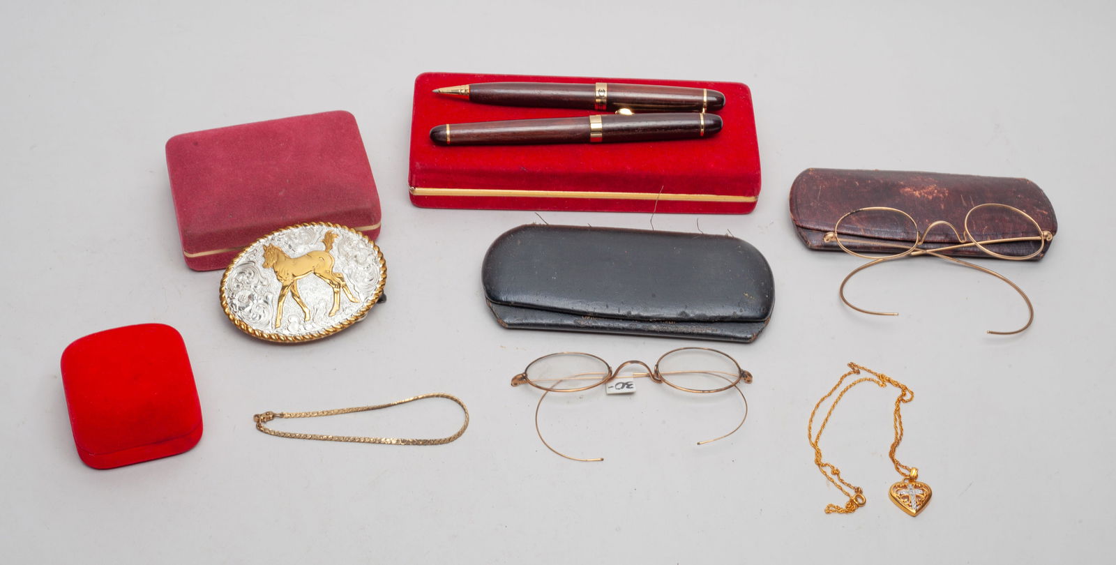 Vintage Decors & Pieces: Including two vintage pairs of glasses, a necklace and a bracelet, two pens, and a belt buckle marked CRUMRINE MADE IN U.S.A, with cases. Size varies.