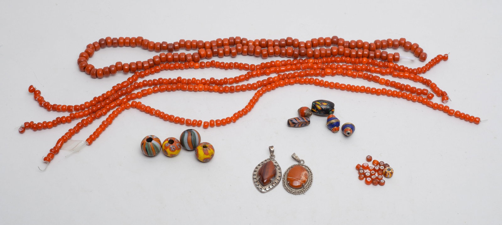 Asian Red Glass Prayer Beads & Eye Beads: A large group of Asian red glass prayer beads and eye beads. Size varies.