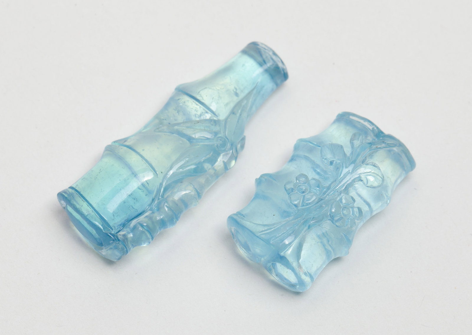 High Quality Chinese Aquamarine Bamboo Pendants: Two high quality aquamarine bamboo form pendants, wherein one carved with flowers. Approx. 16.4 gram (total weight),1.65*0.56 inch