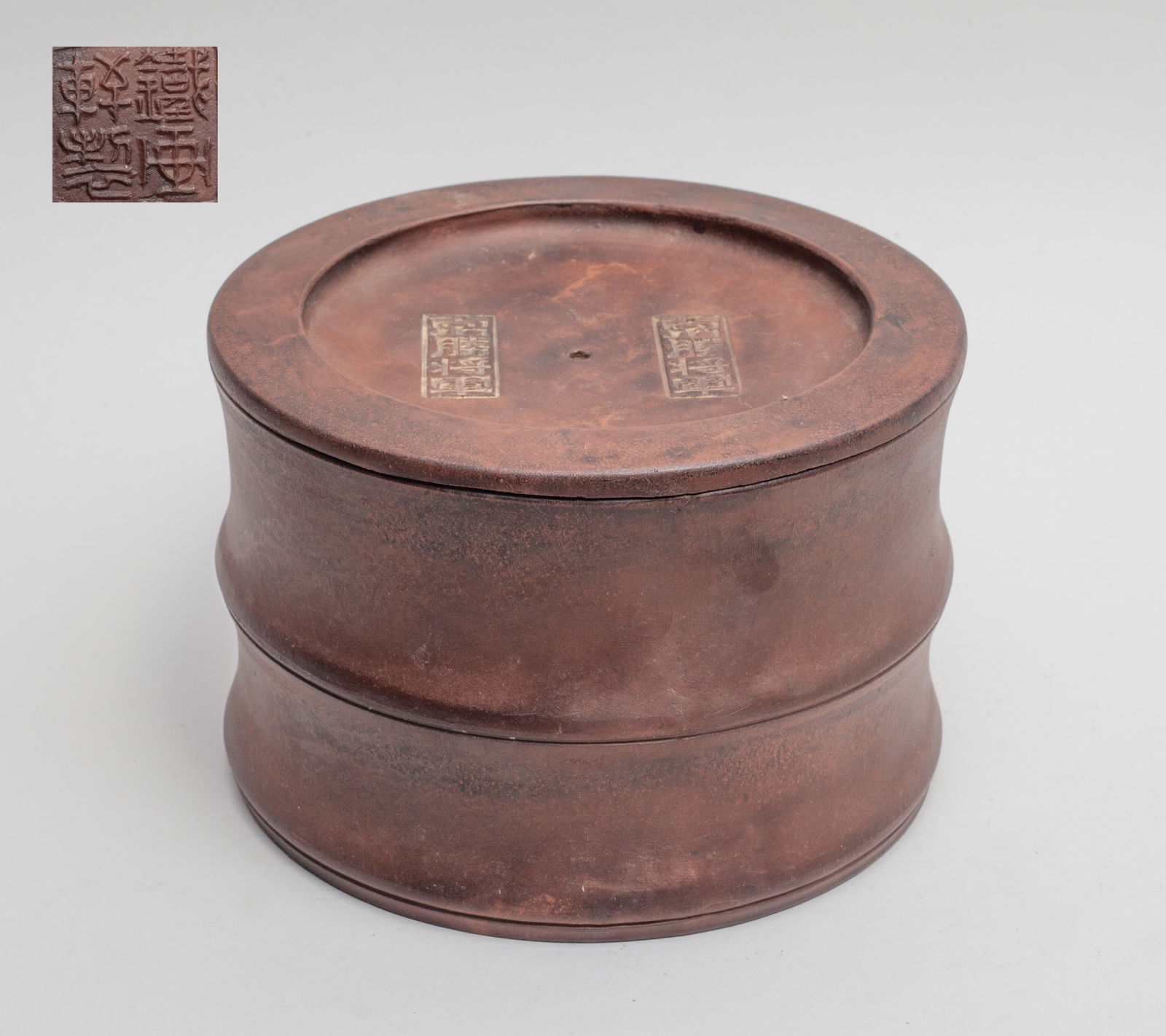 Chinese Yixing Zisha Cricket Jar: Chinese Yixing zisha cricket jar, the lid carved with two marks, each framing four characters, the bottom carved with a seal mark. Approx. 5.4*3.5 inch.