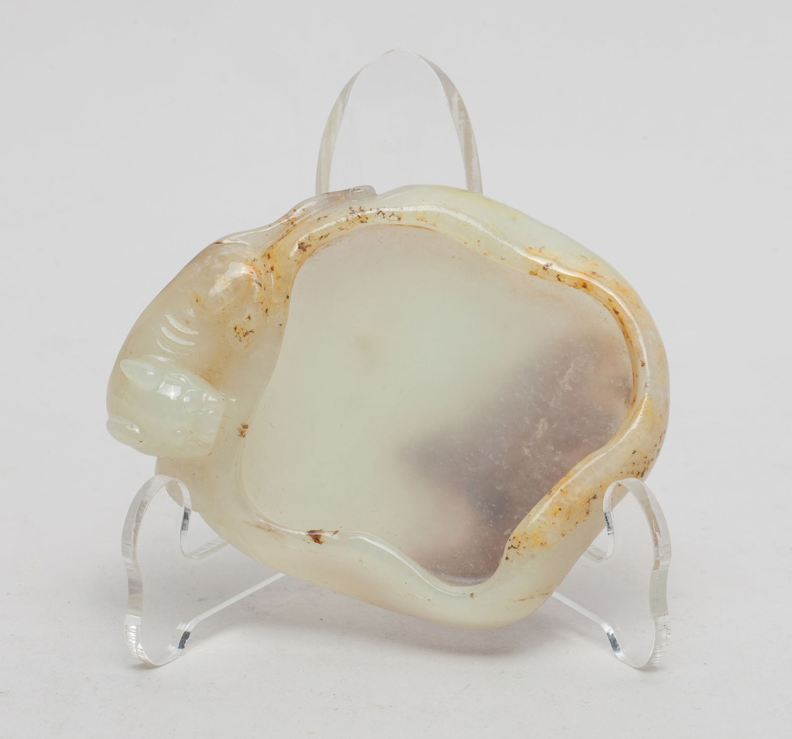 Chinese Russet Jade Brush Washer: The shallow vessel with undulating rim, a beast recumbent on the side, the stone of white tone with yellow brown inclusions.. Approx. 3.05*2.4 inch.
