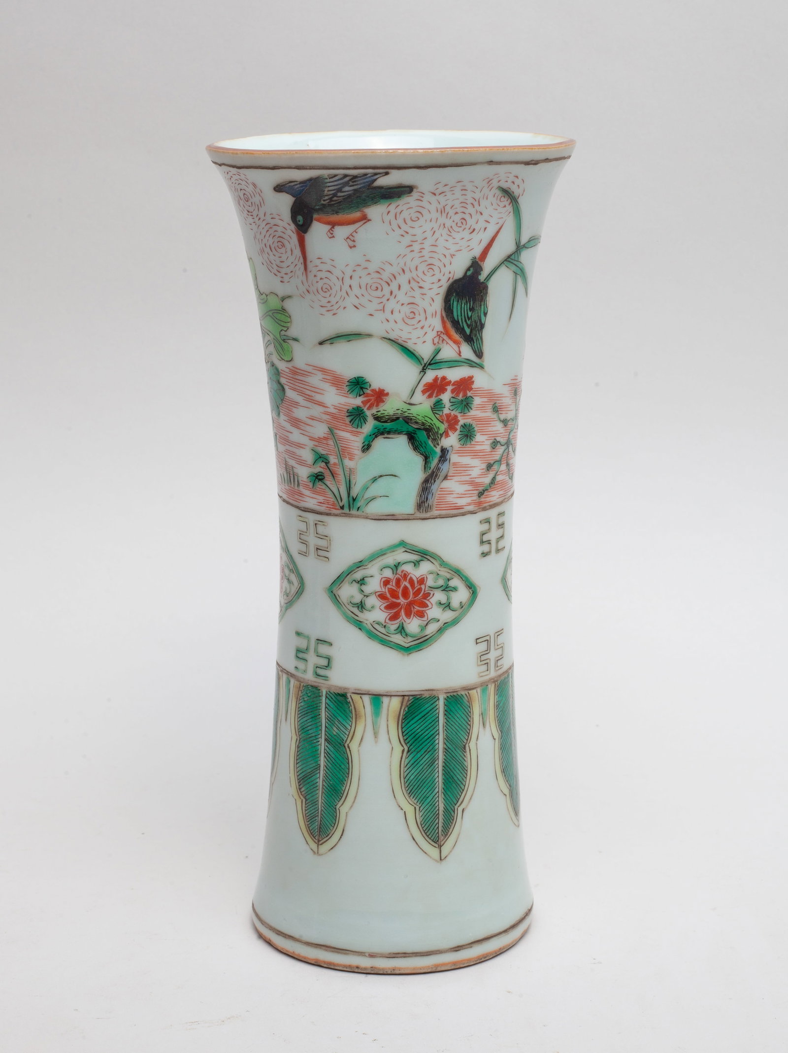 Chinese Wuchai Porcelain Cabinet Vase: Modeled in form of archaic gu vase, the exterior painted with birds amongst flowers and rockery, above flowering sprays and pendent plantain leaves. Approx. 8.4*3.7 inch