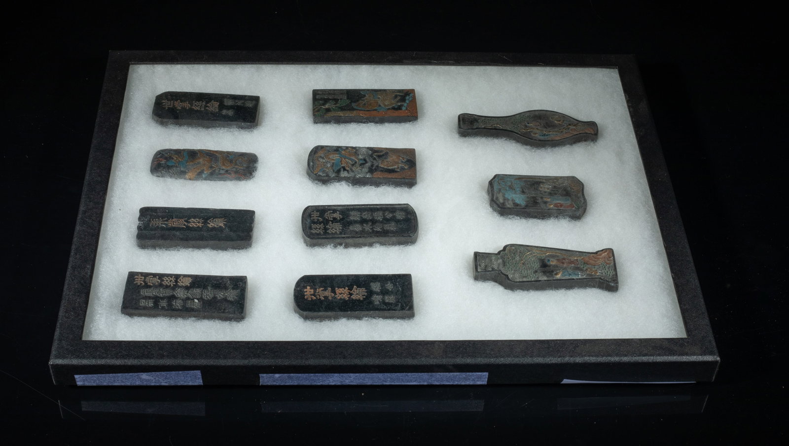 Chinese Export Ink Sticks: Group of 11 Chinese ink sticks, carved with figures in garden setting, dragon, beast, or horse, with inscription, with case. Size varies.