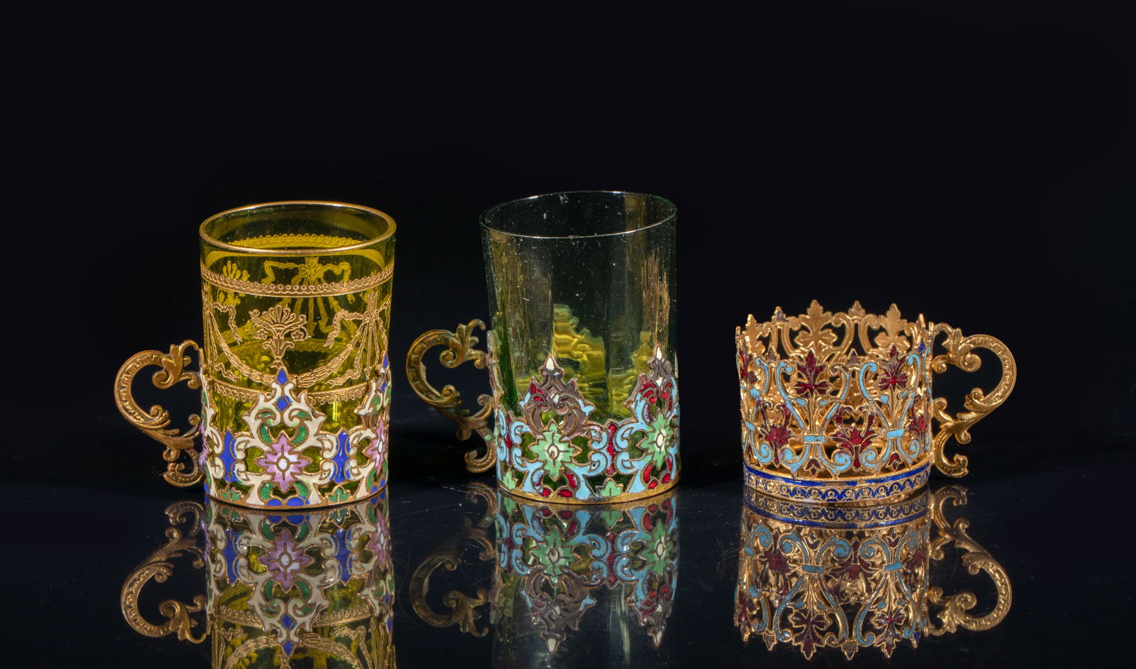 1900s France Cloisonne Cup Stands: Set of three French style cloisonne cup stands, cast in delicate foliage form and glazed, wherein two with colored glass cups. Approx. 2*2*1.38 inch (largest with glass cup).