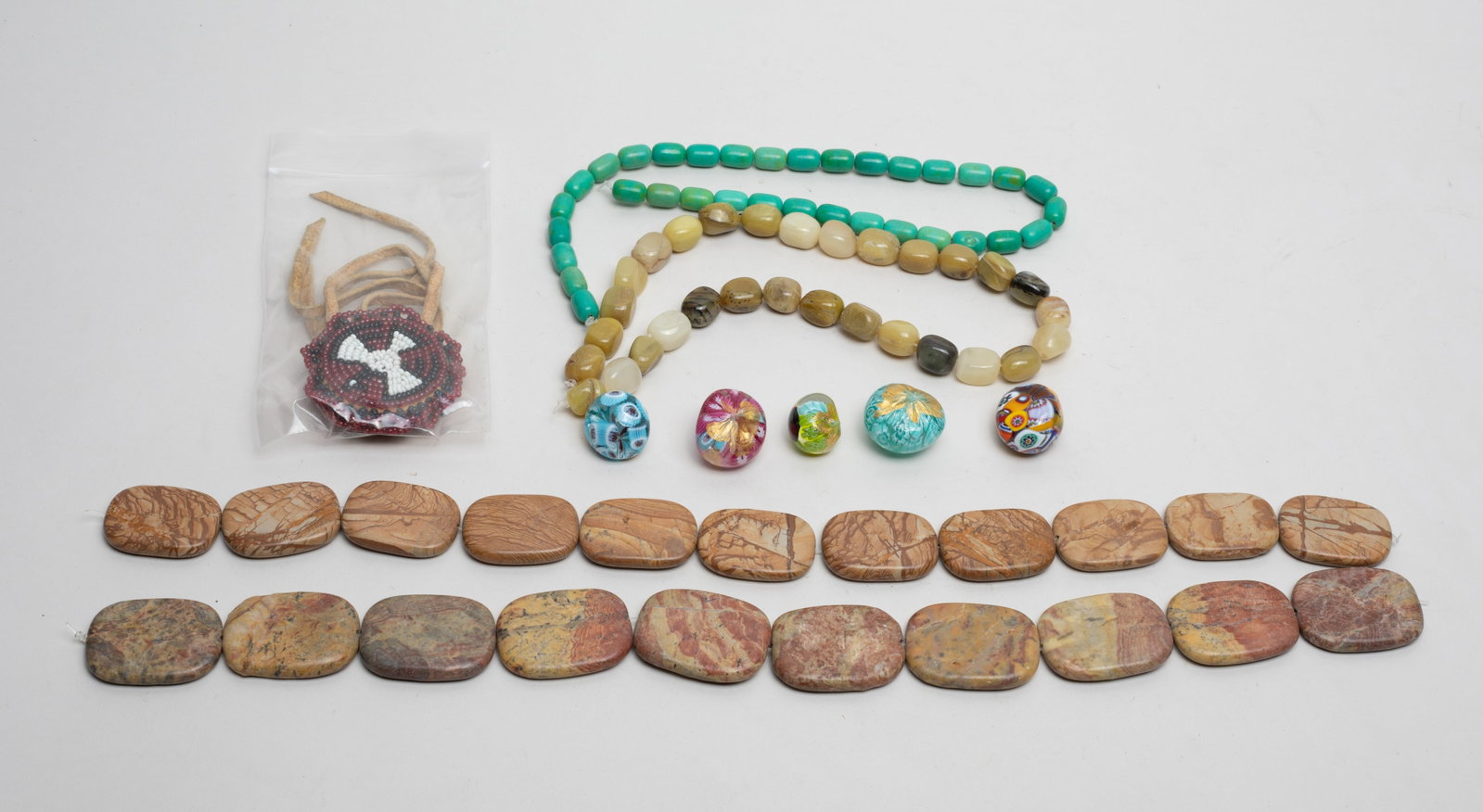 Jasper, Glass & Gemstone Collections: Including jasper and gemstone carved beads, art glass pieces, and a decor bead pendant. Size varies.