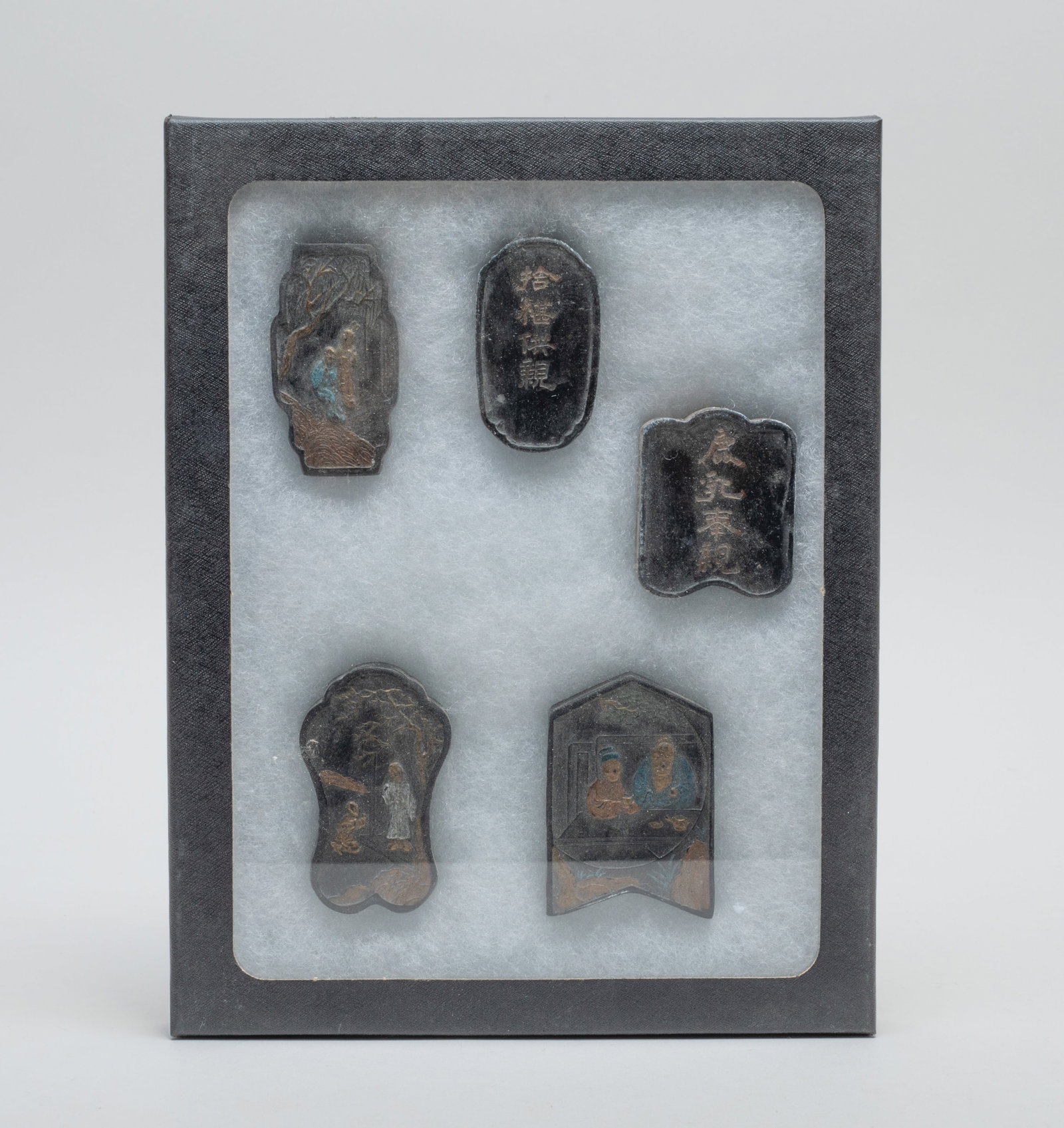 Estate Chinese Ink Sticks: Set of five Chinese ink sticks, each carved with figural scene on one side and inscribed with related passages on the reverse side, with case. Size varies.