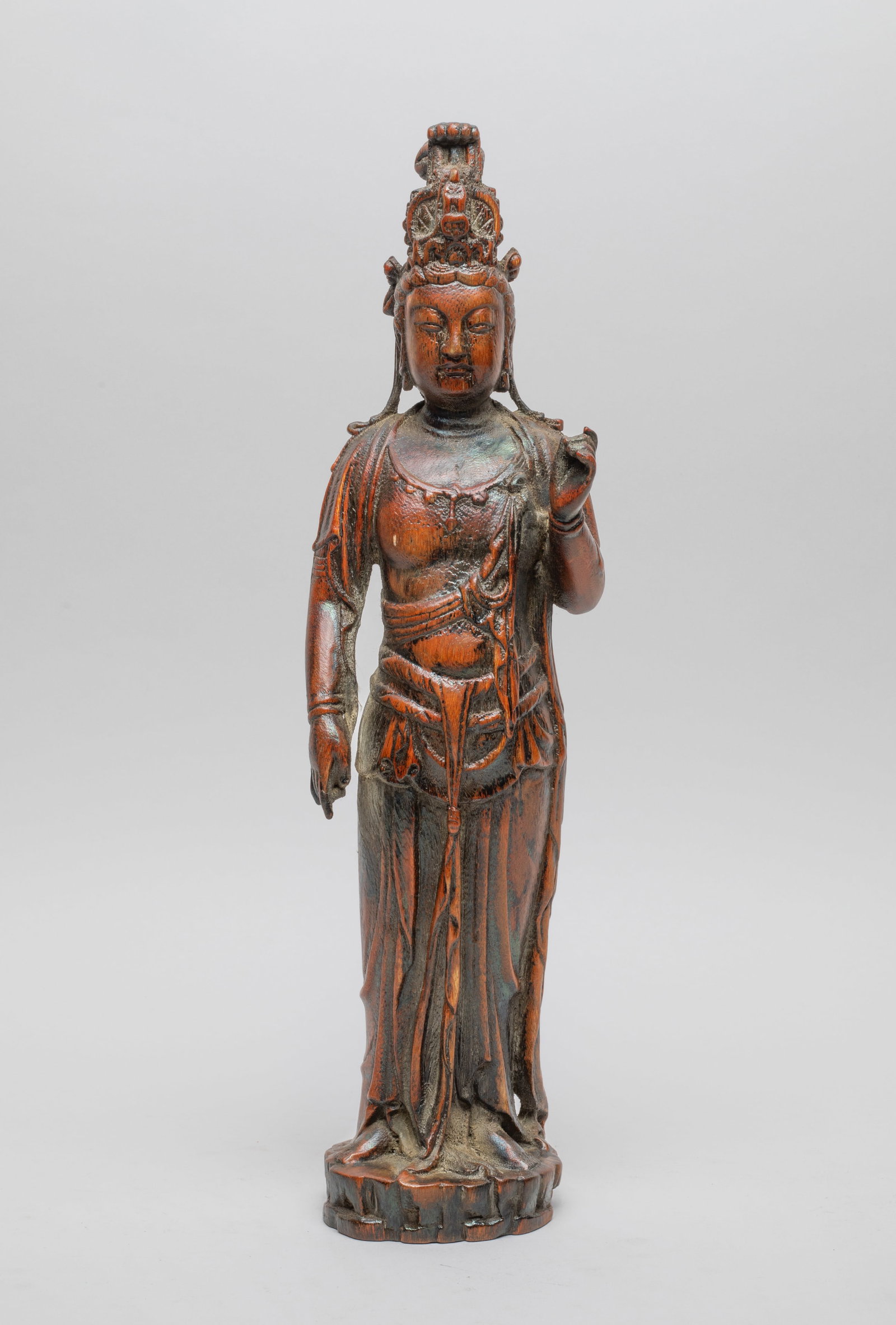 Chinese Bark of Agarwood Sculpture of Kuanyin: Chinese agarwood-bark table sculpture carved in form of standing Kuanyin, the left hand in vitarka mudra and right hand in karana mudra, dressed in a long loose-fitting robe. Approx. 14.1*3.2*3.1 inch