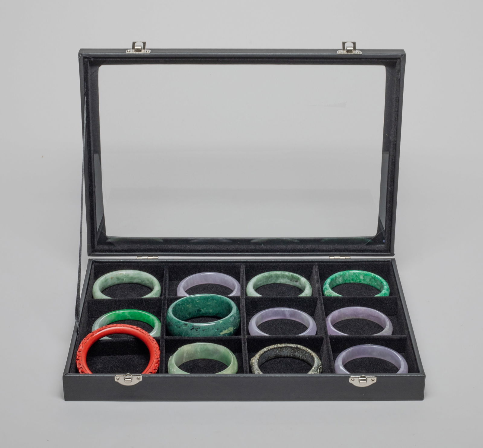 Estate Chinese Export Bangles: Group of 12 Chinese bangles, wherein 1 bangle carved with beast, bird and flower, and 1 bangle carved floral scrolls, with box. Approx. 3.1inch outer diameter, 2.45inch inner diameter, 1.05 inch width