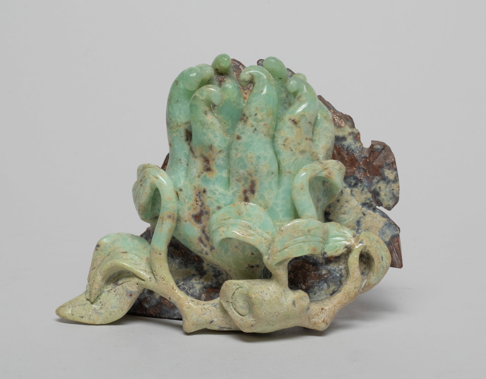 Chinese Stone Carved Sculpture of Buddha Hand: Naturalistically carved as a buddha hand fruit issuing from a leafy stem. Approx. 4.5*3.5*1.8 inch.