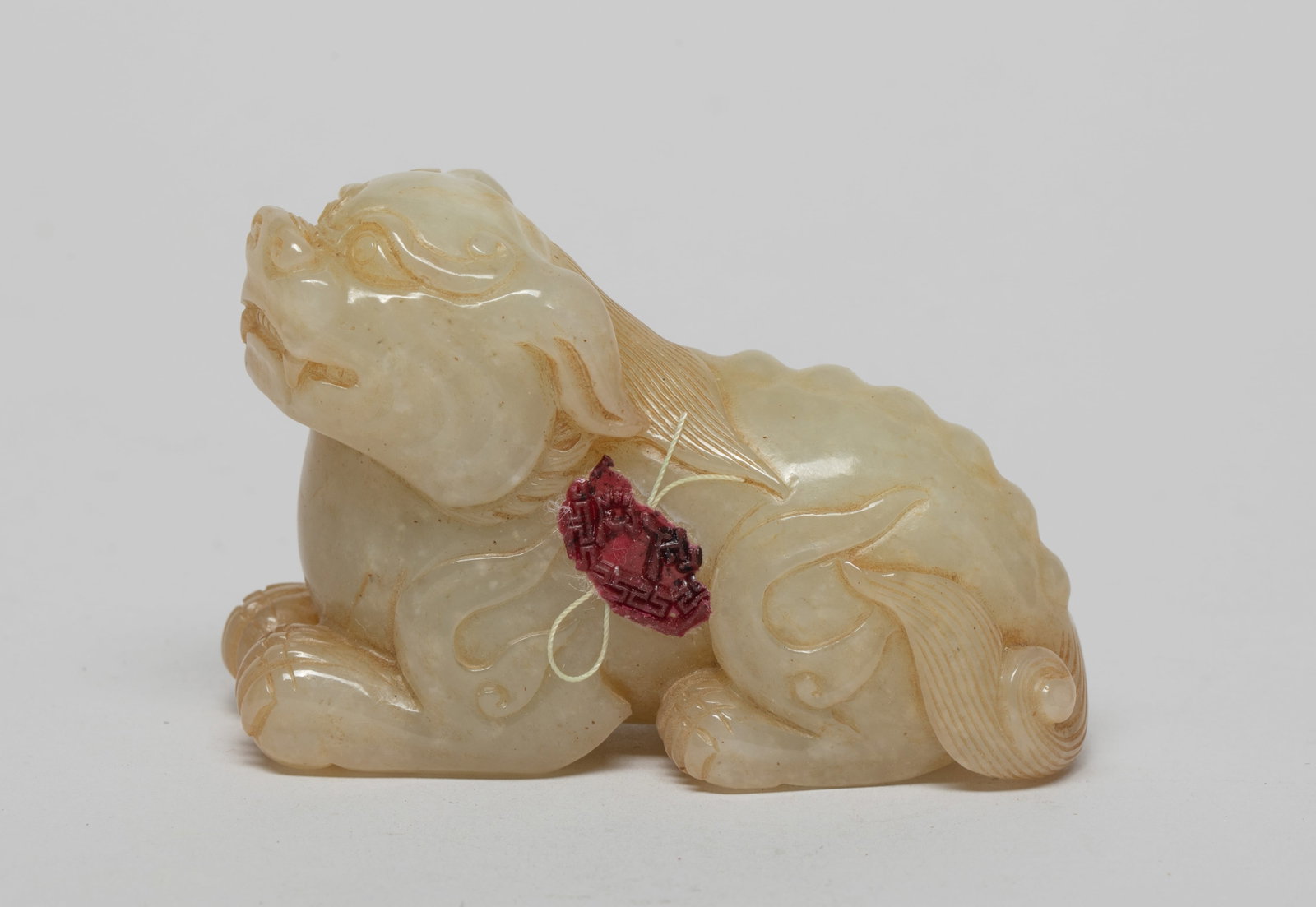 Chinese Jade Carved Sculpture of Beast: Carved in a recumbent pose, the head turned slightly to the left, detailed with finely incised mane and bony spine flanked. Approx. 2.7*1.8*1.2 inch.