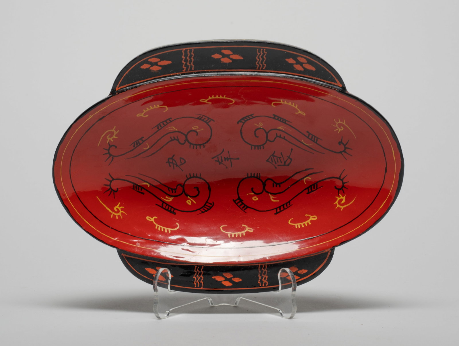 Chinese Lacquer Boat Cup: Of oval shape with a pair of handles on the sides, the interior painted with scrolls and three characters. Approx. 7*5.2*1.3 inch.