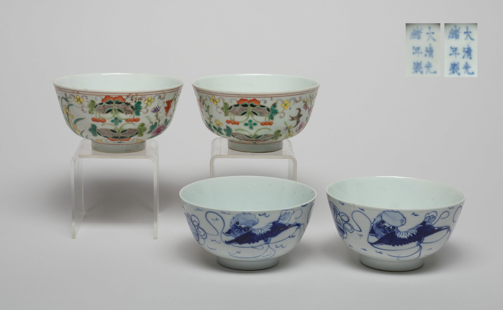Set Estate Chinese Porcelain Bowls: Including a pair of blue and white porcelain bowls painted with qilin playing ball, mark on the bottom, and a pair of bowls enameled and painted with butterflies, birds and flowers, six-character mark