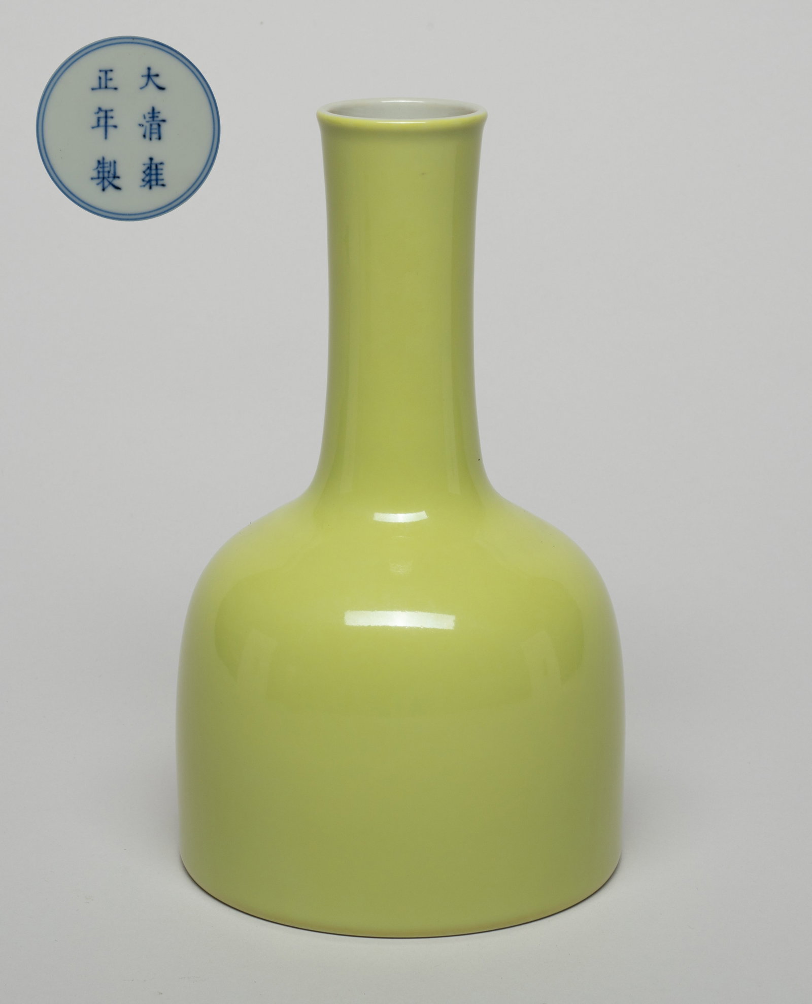 Chinese Yellow Glazed Porcelain Vase: The vase exterior applied in even bright yellow glaze, the bottom marked with six characters enclosed in double circles. Approx. 7.2*4.2 inch. The Estate of the F. T Chung, Palm Spring , 2009.