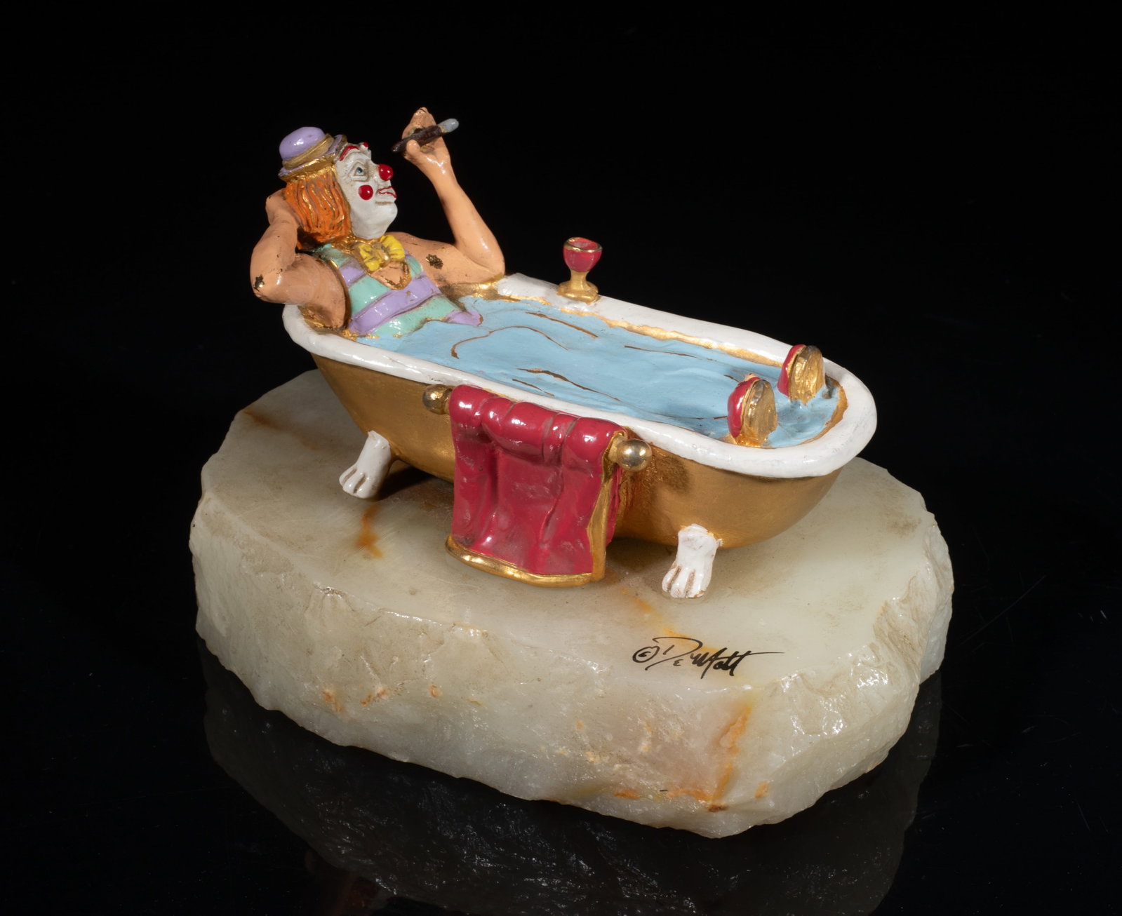 Mid-century 24k G/F Metal & Marble Sculpture: Vintage metal table sculpture cast as a clown in bathtub smoking a cigar, the bathtub exterior 24K gold filled, with a marble base. Approx. 6*4*3.8 inch.
