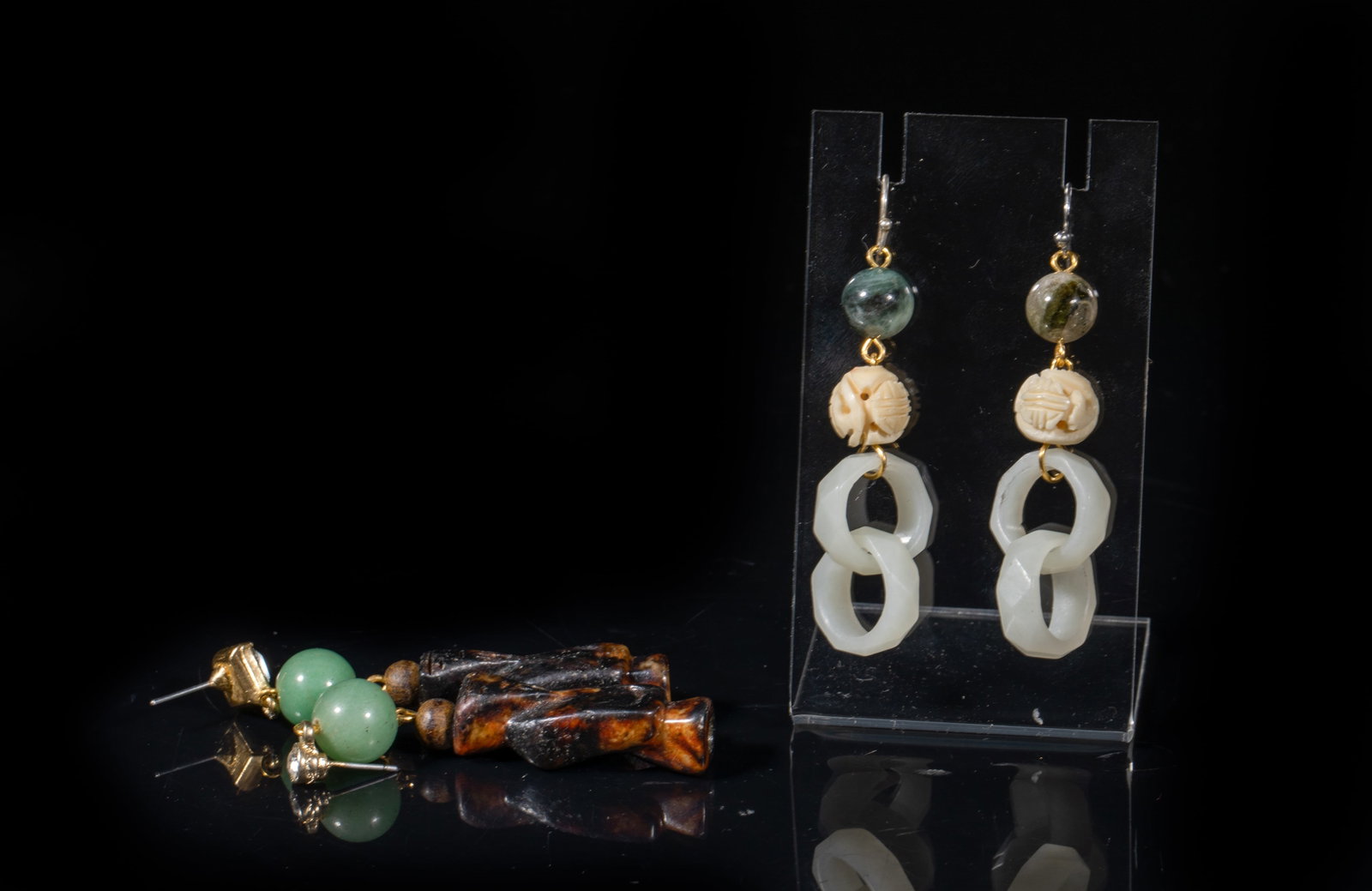 Two Pairs Chinese Jade Earrings: One pair comprised of gemstone beads, bone carved beads and interlocking jade loops, the other pair comprised of jade-like beads, wood beads, and jade carved figure pendants. Approx. 1.3*0.4*0.4 inch 