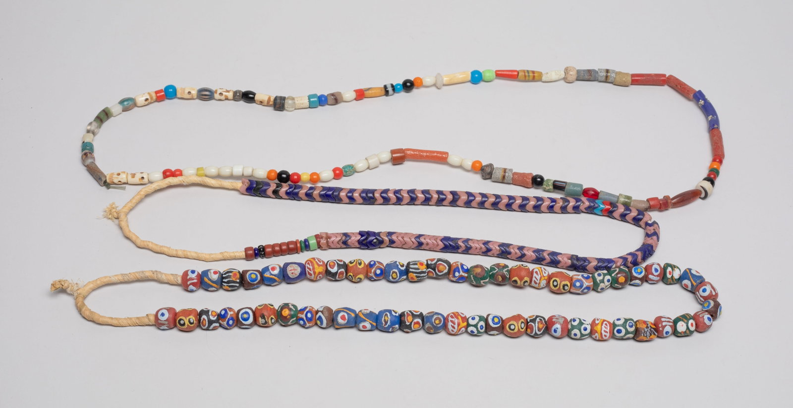 Collectible World Trade Glass Beads Necklace: Three special world trade glass bead and decor bead necklaces. Approx. 34inch L.