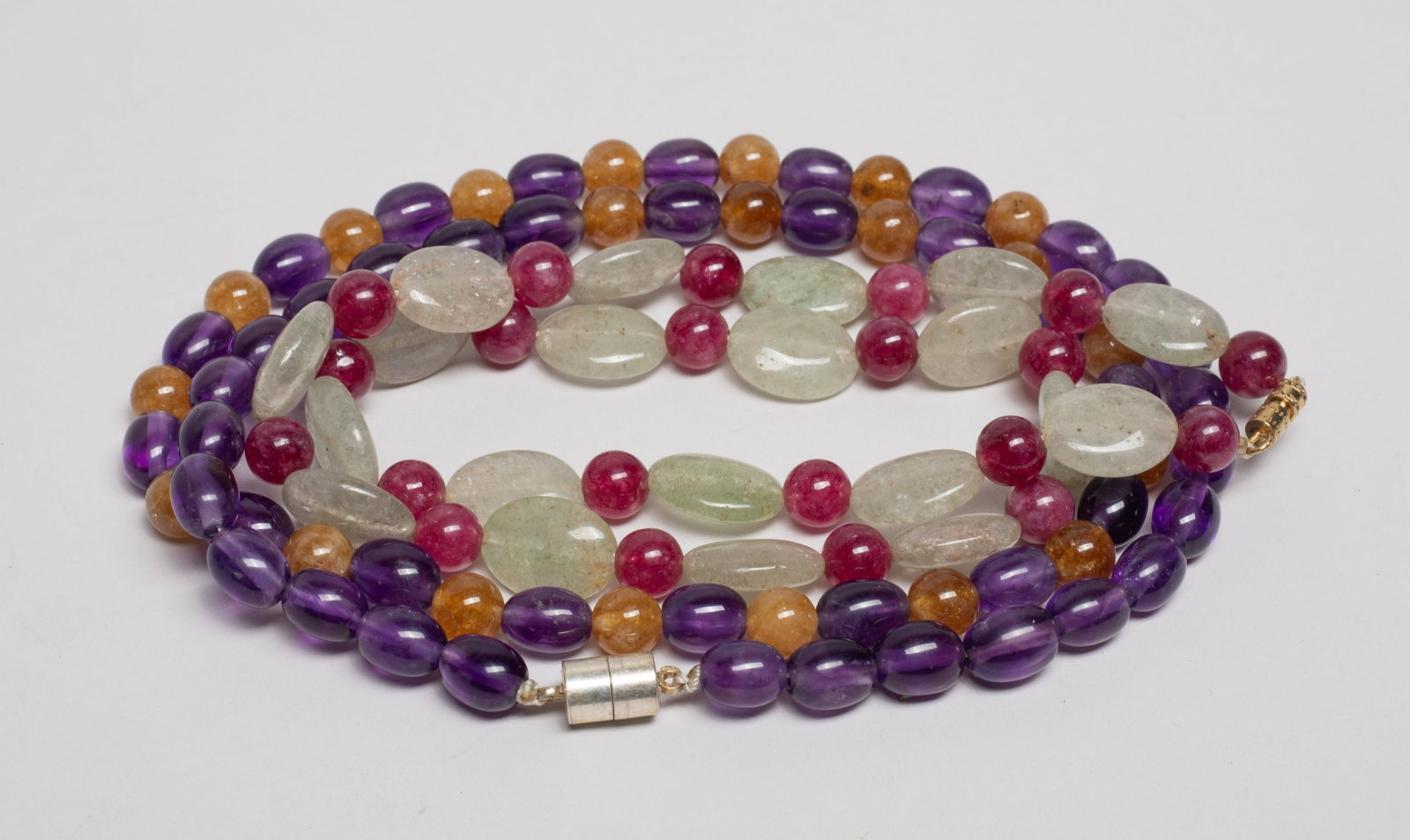 Estate Asian Amethyst, Aquamarine & Stone Necklace: Two Asian bead necklaces, one comprised of amethyst and honey-brown gemstone, the other of aquamarine and purple-red gemstone. Approx. 24inch L (larger).