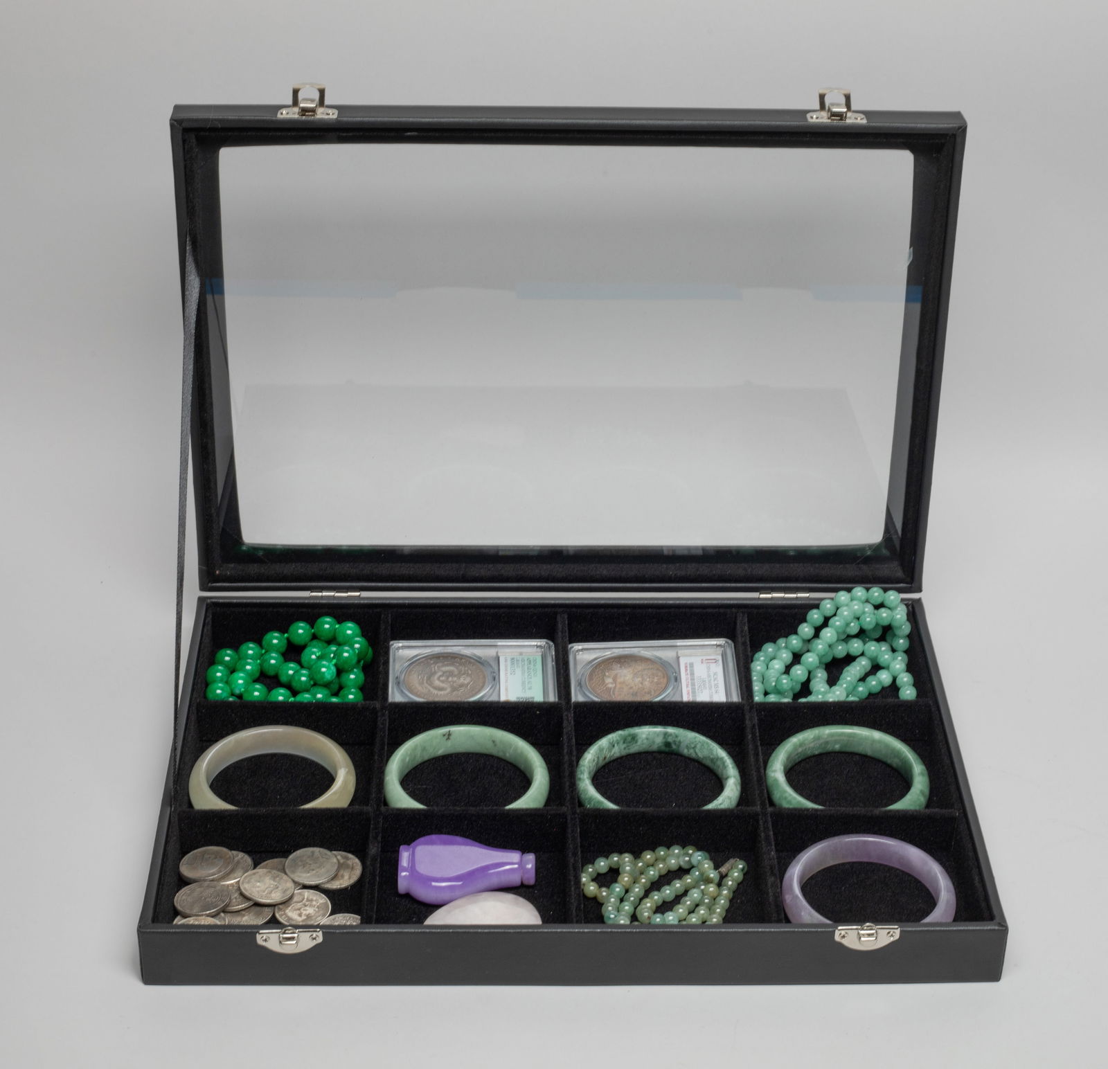 Chinese Fengshui Coins, Bangles & Decors: Including 3 bead necklaces, 5 bangles, a quartz bear pendant, a colored stone snuff bottle, and a large set of Chinese Fengshui coins, with case. Approx. 31inch L (longest necklace).