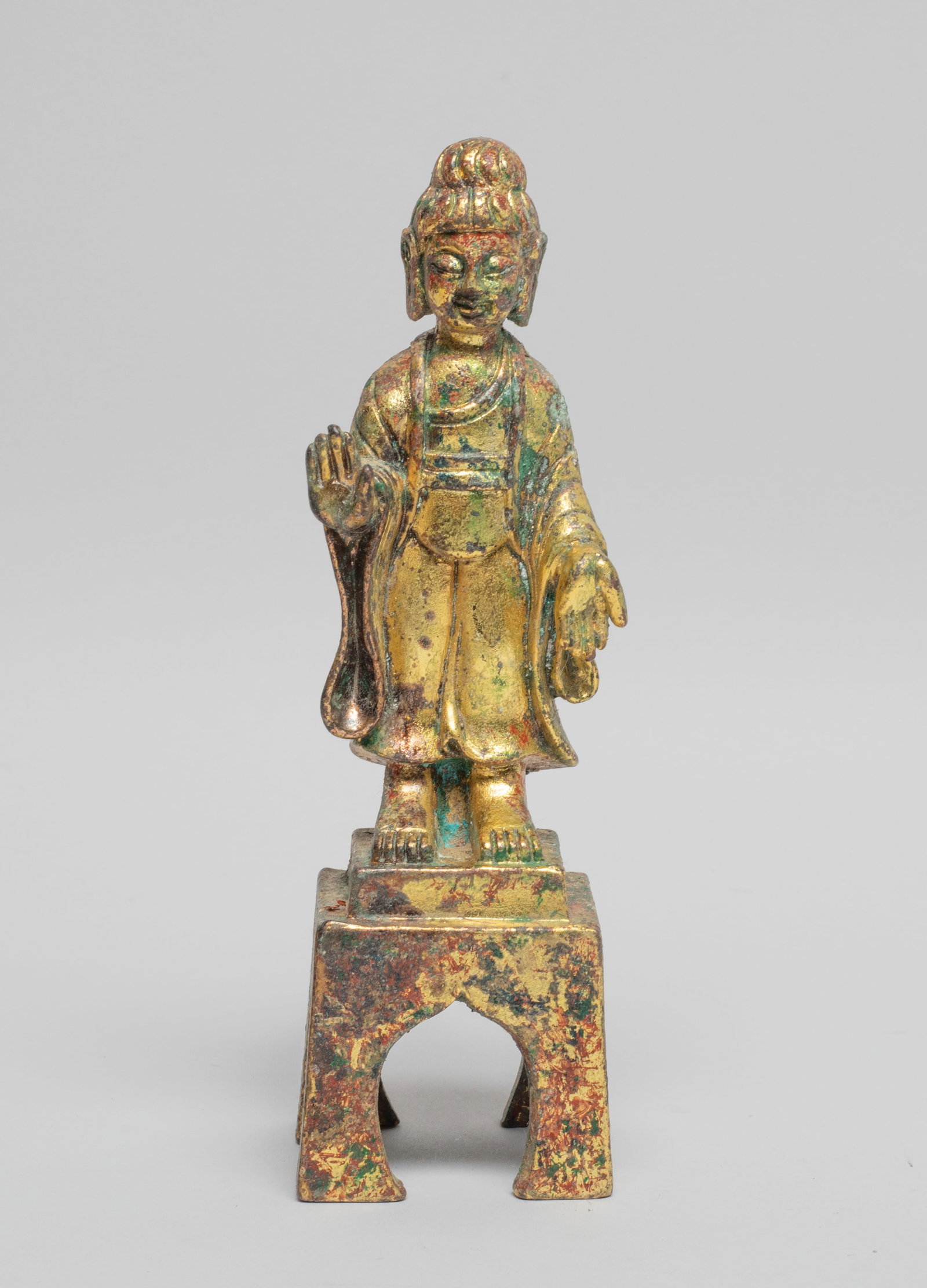 Chinese Gilt Bronze Buddha: The Buddha cast seated on a square pedestal, the hands in abhaya mudra, wearing a loose-fitting robe. Approx. 5.8*1.8*1.8 inch.
