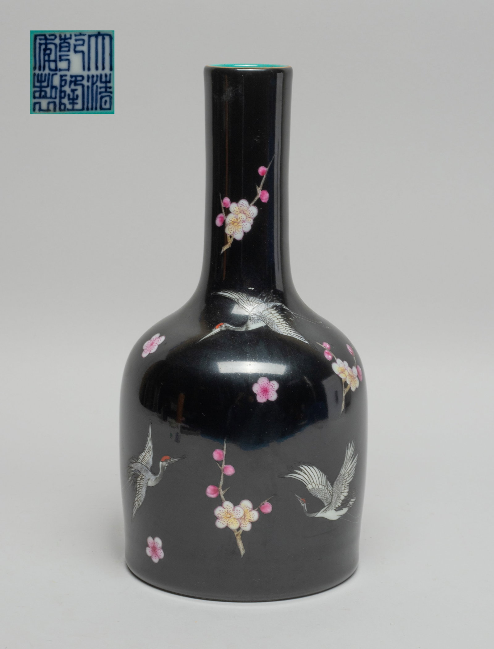 Chinese Export Porcelain Vase: The vase exterior enameled with cranes and plum blossoms on black glazed ground, the interior and the bottom turquoise glazed, the bottom inscribed with a six-character mark. Approx. 9*4.3 inch.