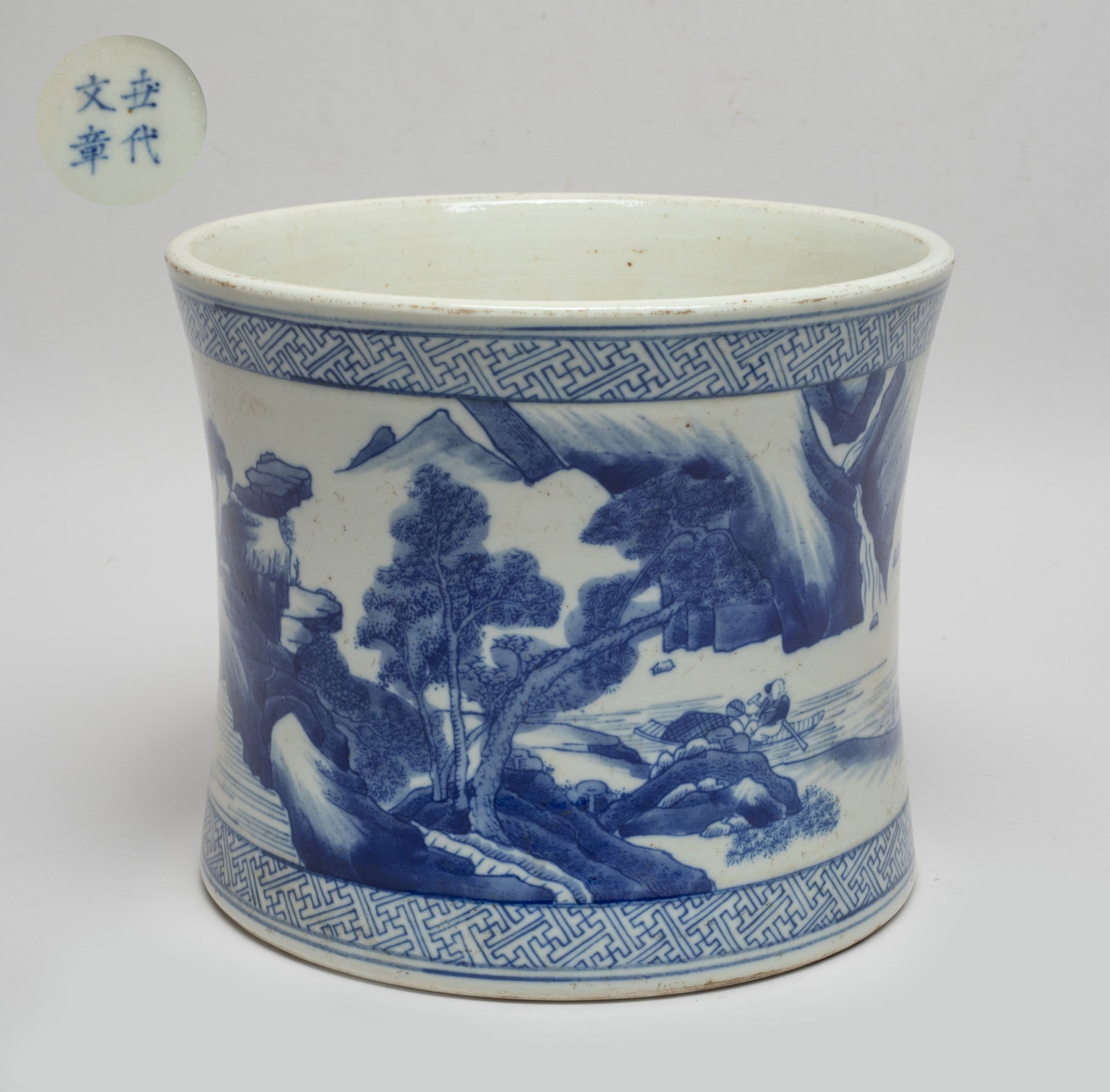 Chinese Blue & White Porcelain Brush Pot: The cylindrical brush pot of gently waisted form, the exterior painted with continuous landscape scene, the bottom marked with four characters. Approx. 7.6*6.3 inch.