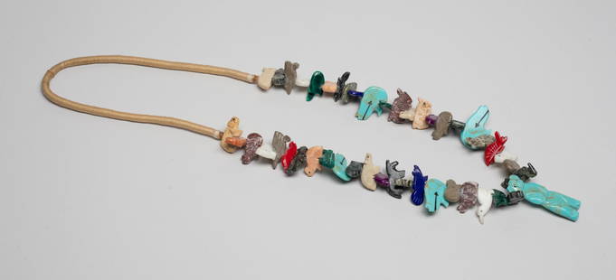 Zuni Fetish Strong Necklace: Zuni fetish necklace with multi-gemstone pendants carved in various animal form. Approx. 30inch L.