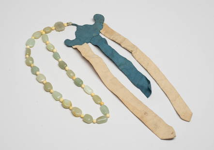 Chinese Russet Pebble Jade Prayer Beads: A long string of Chinese pale celadon and russet jade prayer beads, with a special jade bead carved in openwork as a pair of bats framing a shou character and a cloth cut decor. Approx. 0.8*0.7*0.25 i
