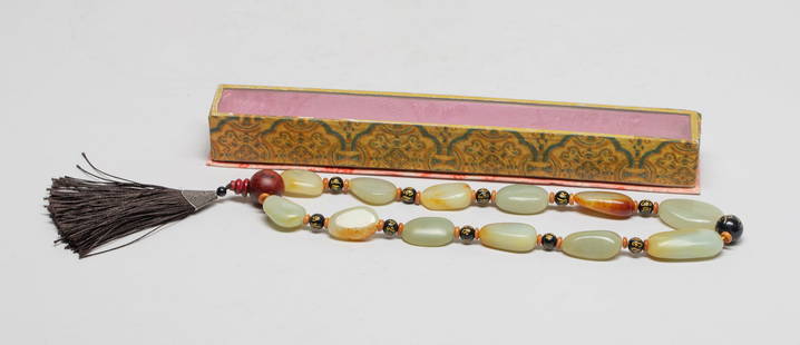 Estate Chinese Export Jade Prayer Bead: The beads string comprised of russet jade pebble beads, beads carved characters and a wood bead, with black tassel, with case. Approx. 1.45*0.75 inch (largest bead).