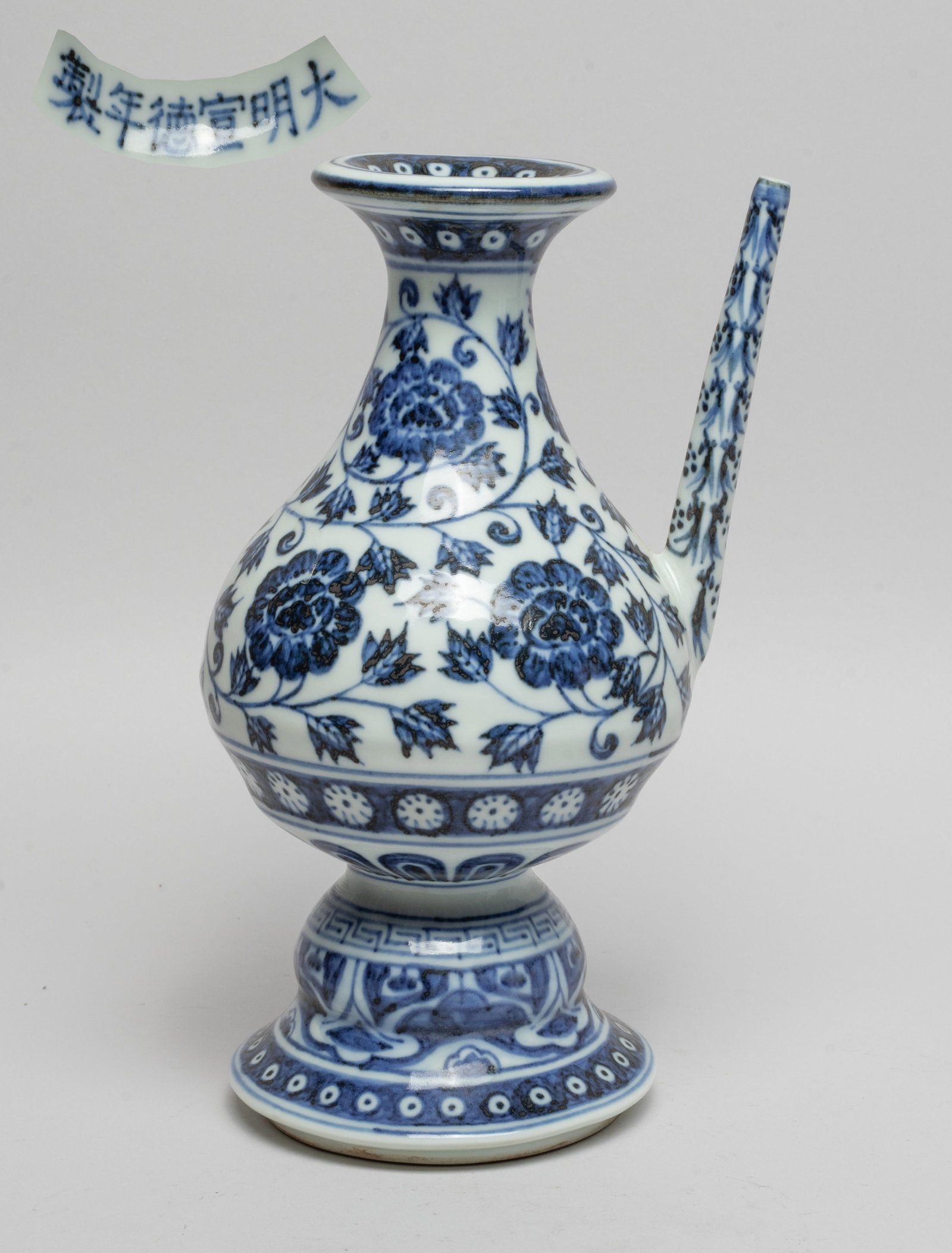 Chinese Export Porcelain Water Pot: The pot body painted with undulating leafy lotus sprays, the foot with bands of flowers and petals, the straight spout with stylized flowers, six-character mark on the foot inside. Approx. 8.6*5.2*4.3