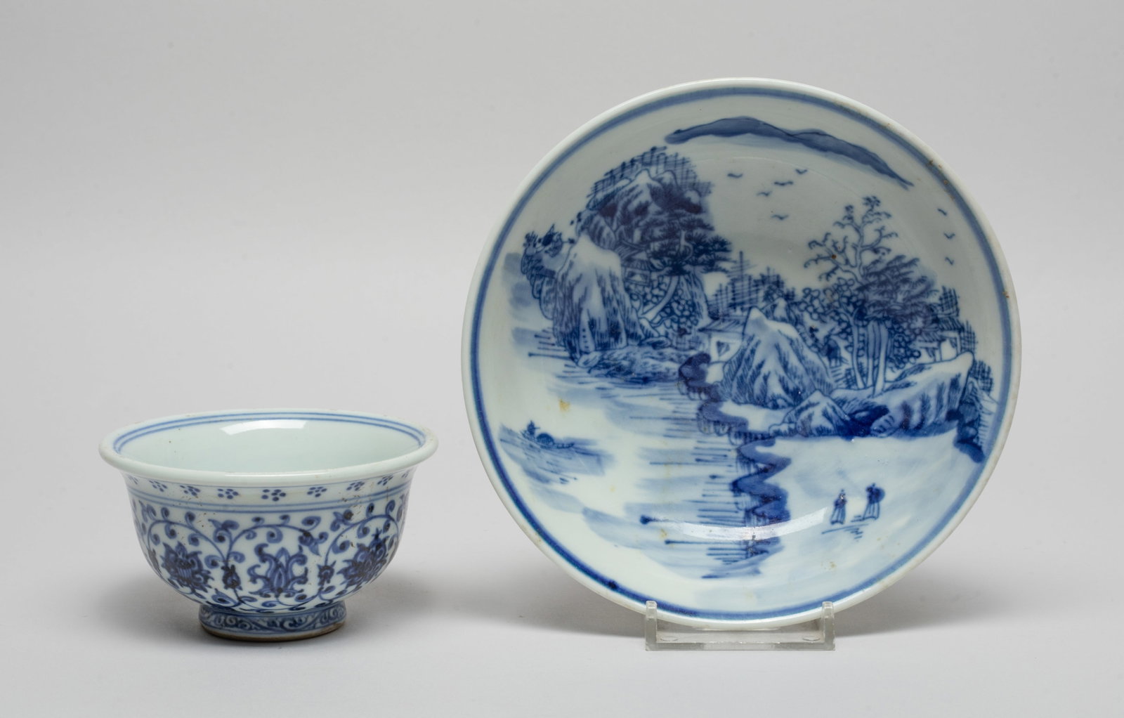 Chinese Blue & White Porcelain Cup & Bowl: The bowl interior painted with riverbank landscape scene, the exterior with bamboo, the cup interior centre painted with a pair of qilin surrounding a beribboned ball inscribed with four characters, t