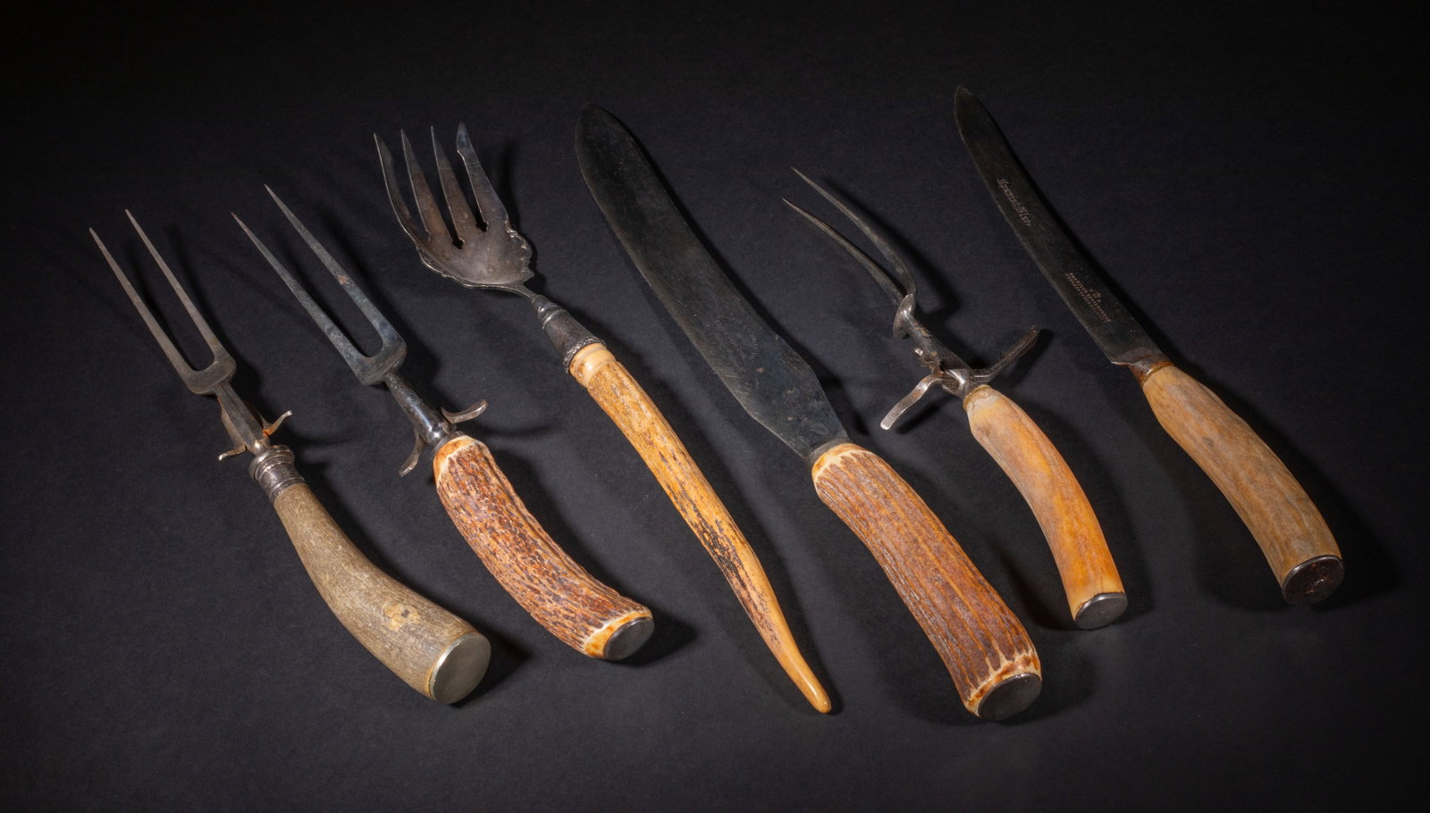 Estate Vintage Flat Wares: Including two serving knives and four serving forks, wherein one knife marked HARRISON BROS & HOWSON CUTLERS TO HERMAJESTY, the other knife marked BULLARD & GORMLEY CO DOUBLE SHEAR STEEL WARRANTED. Si