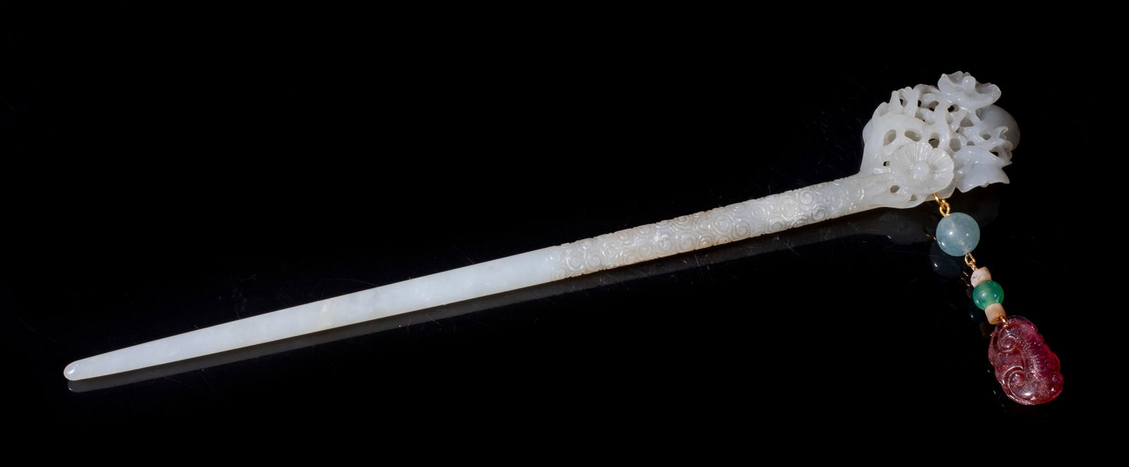 Estate Chinese Jade Long Hairpin: Chinese white jade long hairpin, the terminal finely carved in openwork relief with intertwined stems issuing plum blossoms, suspended with an aquamarine bead, a green stone bead and a tourmaline togg