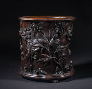 Estate Large Chinese Wood Brush Pot: Rendered as a gnarled section of a tree trunk with various stylized nodes and whorls, carved in relief with bamboo, pine tree and plum blossoms. Approx. 8.4*7.7*5.7 inch.