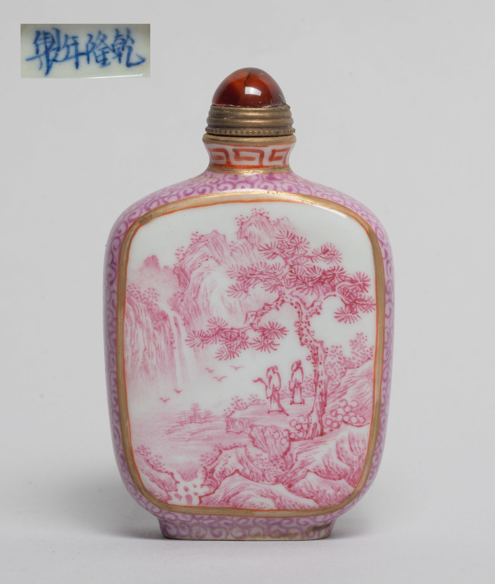 Chinese Famille Rose Porcelain Snuff Bottle: Of rectangular section, one side painted in pink tone with landscape scene, the reverse inscribed with related poems, the narrow sides suffused with pink scrolls, the bottom marked with four character