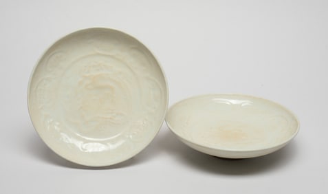 Two Chinese Cream Glazed Porcelain Plates