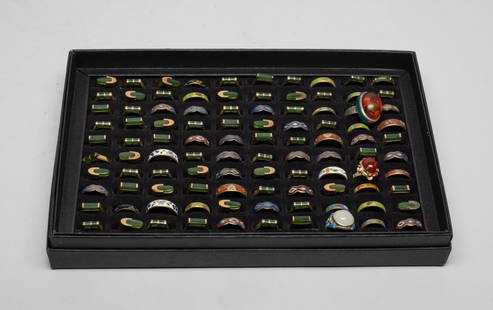 Estate Set Chinese Gold Tone, Jade, Stone Rings: Large set of Chinese rings, wherein some golden-colored rings inlaid with spinach jade, some enameled, some inlaid with stone, with a tray. Size varies. The Estate of the Store Closed Sale in DTLA.