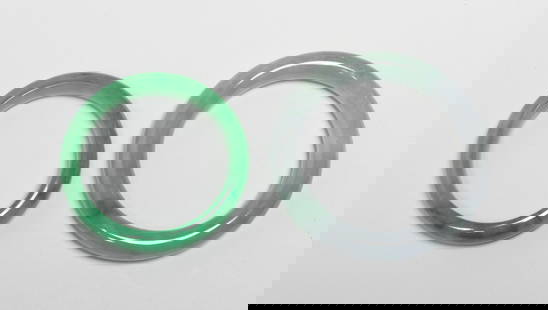 Two Chinese Export Bangles: Two Chinese colored stone bangles. Approx. 3.2 inch outer diameter, 2.3 inch inner diameter (larger).