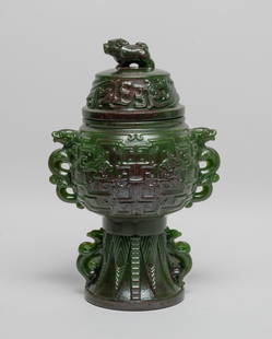 Estate Tall Chinese Covered Vase: The globular body exterior carved with archaistic beasts, flanked by two beast handles, the tall splayed foot carved with leaves and set with two raised beasts, the lid carved with beasts and set with