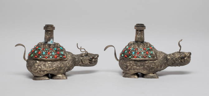 Two Chinese Silver Plated Candle Sticks: Modeled in mythical tortoise form, the body carved with birds flying among clouds, the shell form lid inset with gemstone and surmounted with a cylindrical candlestick holder. Approx. 7.5*4.6*2.9 inch