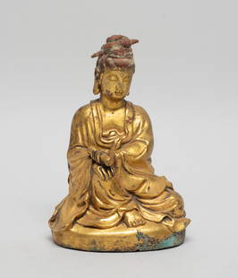 Chinese Gilt Bronze Sculpture of Buddha: Cast as seated Buddha wearing a long flowing robe, holding a scroll book in left hand, the meditative face surmounted with a tall spiral form chignon. Approx. 5.1*3.6*2.6 inch.