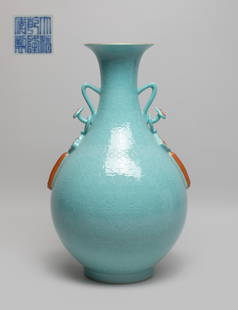 Estate Chinese Export Porcelain Vase: Of pear shape rising from a short foot to a waisted neck with a flared rim, set with a pair of ruyi form handles suspended with knot and tassel, the body applied in soft turquoise glaze and carved wit