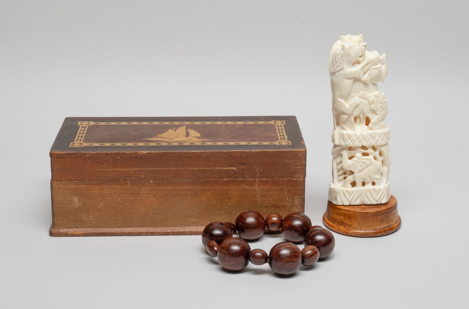 Estate Chinese/ Asian Sculpture & Prayer Beads: Including a string of prayer beads and a sculpture carved and reticulated with elephants and beasts, with a box. Approx. 5.6*2.3 inch (sculpture size).