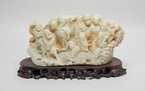 Chinese Export White Jade Like Sculpture: Collectible Chinese white jade like stone table sculpture, skillfully carved with legendary Eight Immortals in various poses, with a wood stand. Approx. 8.6*2.8*4.2 inch (w/o stand).
