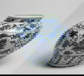 Large Chinese Export Porcelain Jar: Of tapered ovoid form with a short neck, the exterior decorated with a wide band of meandering leafy lotus sprays, beneath a band of lotus sprays and above a band of upright lappets. Approx. 8.7*10 in