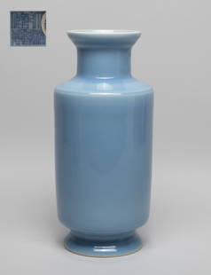 Chinese Blue Glazed Porcelain Cabinet Vase: The cylindrical body rising from a splayed foot to a columnar neck with flared rim, the exterior applied with soft blue glaze, the bottom inscribed with a six-character mark. Approx. 10.5*4.8 inch.