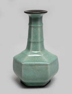 Chinese Export Longquan Porcelain Vase: Of hexagonal section, the compressed body rising from a short foot to a tall neck with a flared rim, overall covered in sea green glaze suffused with a matrix of crackles. Approx. 9*5.7 inch.