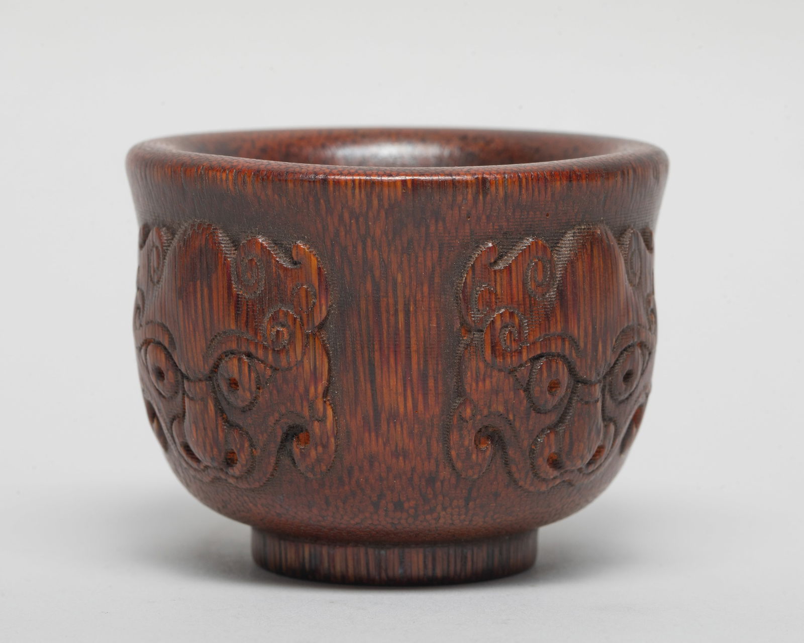 Estate Chinese Export Cup: Chinese export cup carved in raised relief with four beast masks on the exterior. Approx. 2.4*1.9 inch.