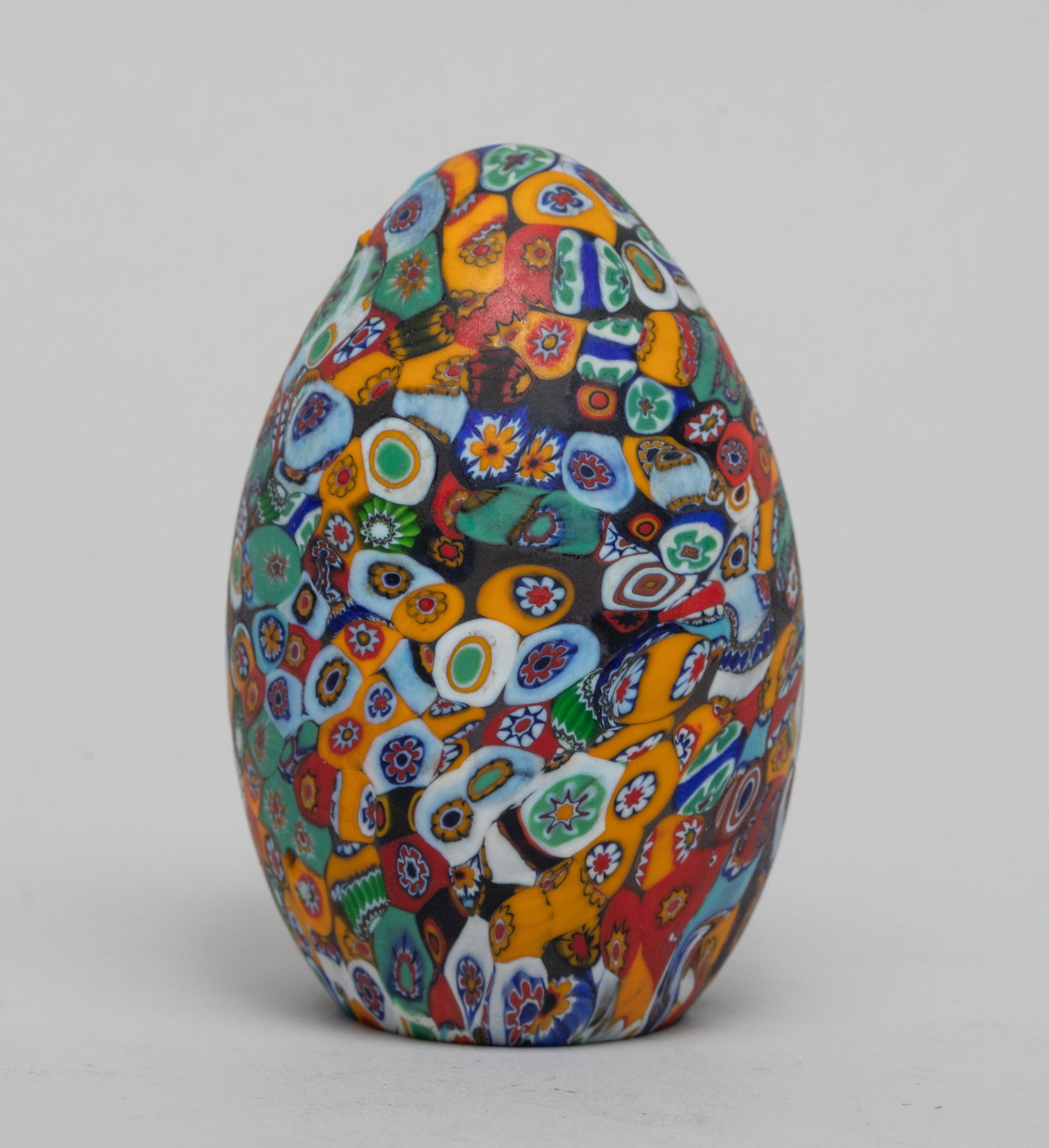 Vintage Millefiori Glass Paperweight: Collectible Italian Millefiori glass egg shaped paperweight. Approx. 2.67*1.75 inch.