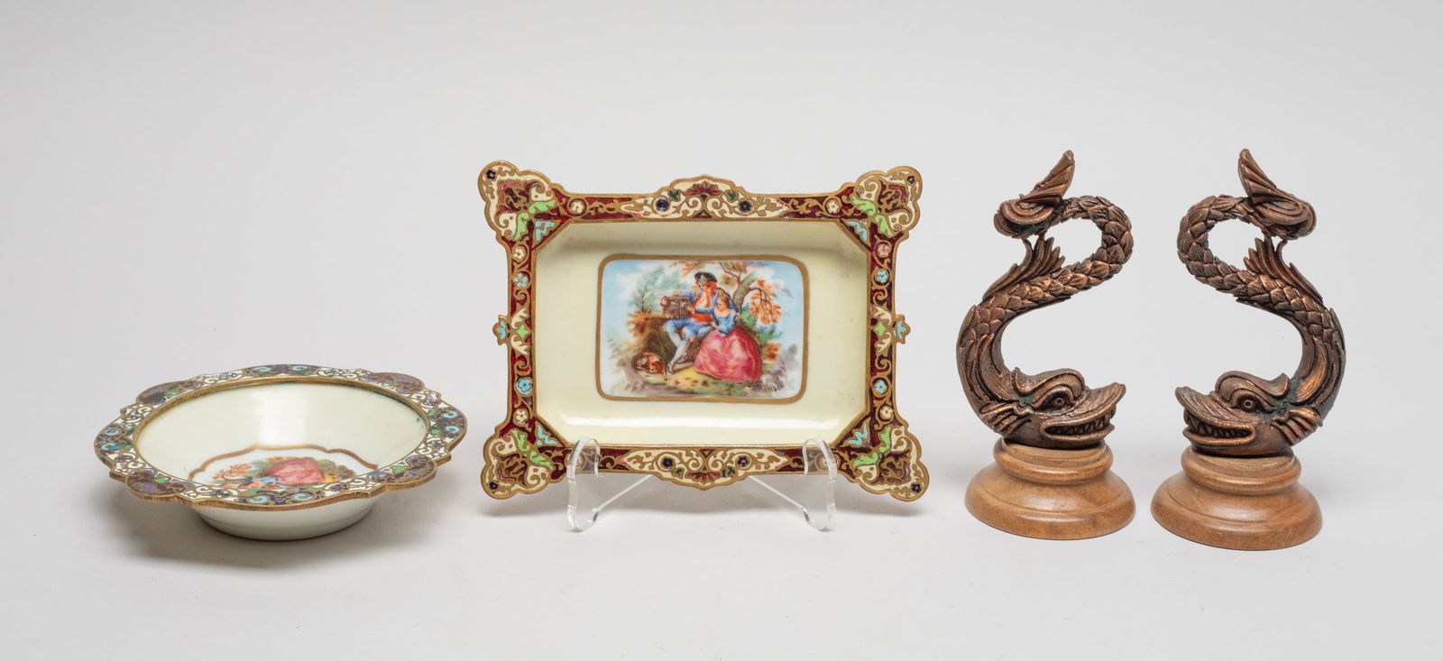 France Antique Enameled Plates, Sculptures: Including two metal sculptures of dragon form, and two porcelain plates painted on the interior with figural scene, with enameled rim, wherein one bottom marked HAND PAINTED MADE IN FRANCE, the other
